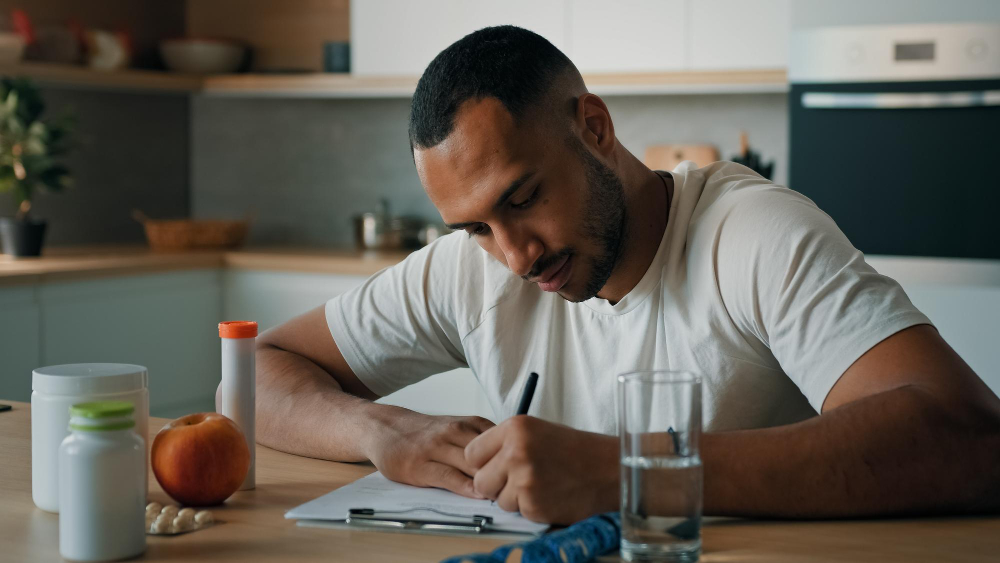 Man counting his calories for weight loss 