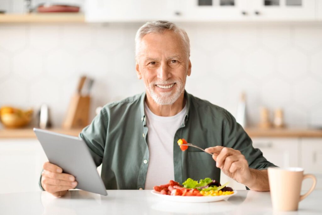 Old man over 60 eating healthy